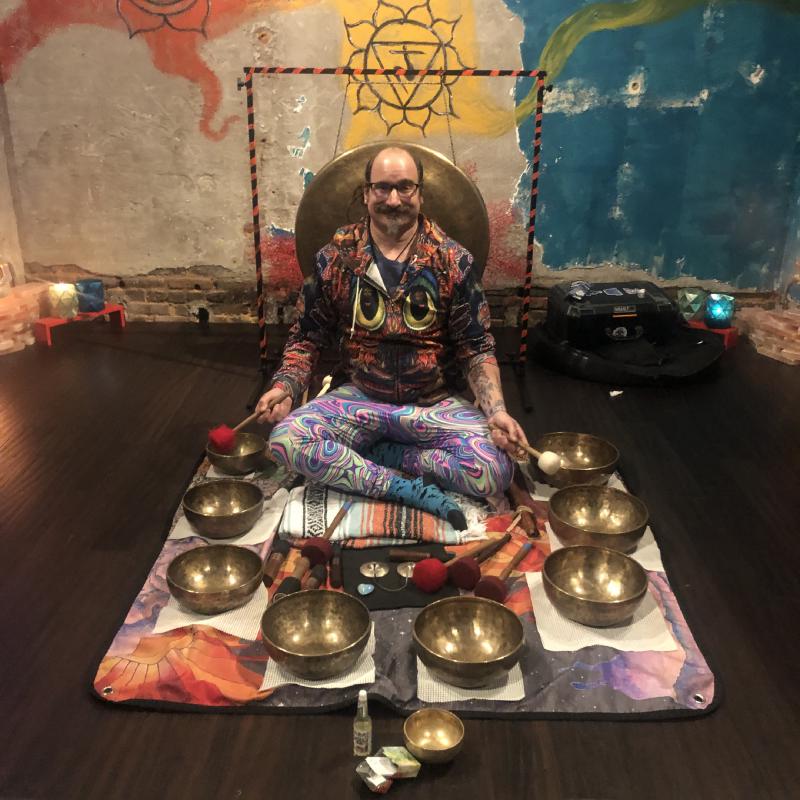 Christian surrounded by singing bowls