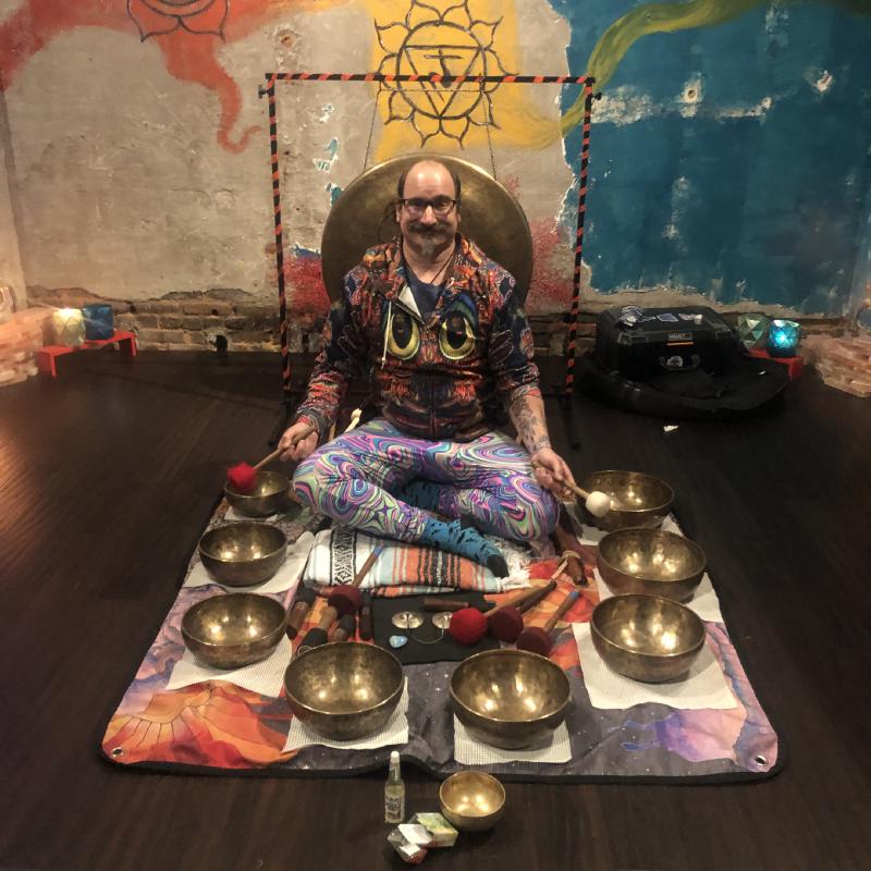 Christian surrounded by singing bowls