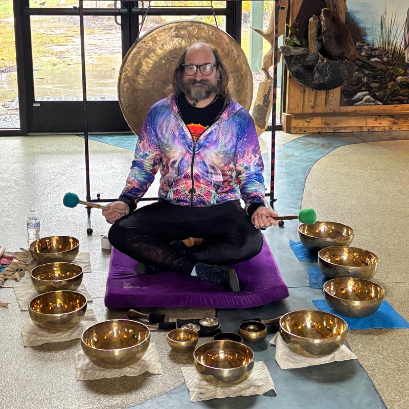 Christian surrounded by singing bowls